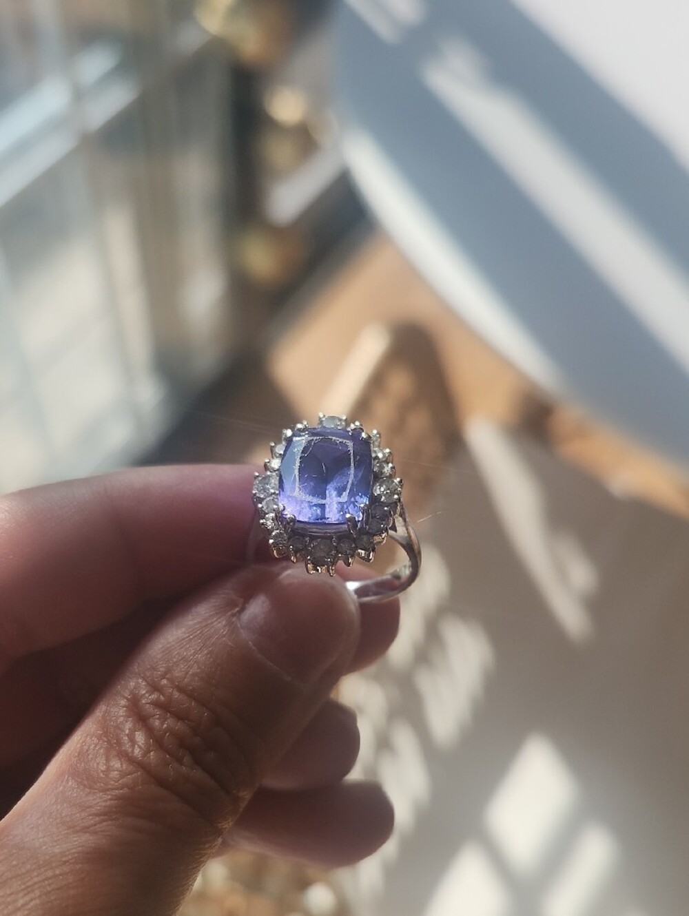 Tanzanite And Diamond Halo Ring